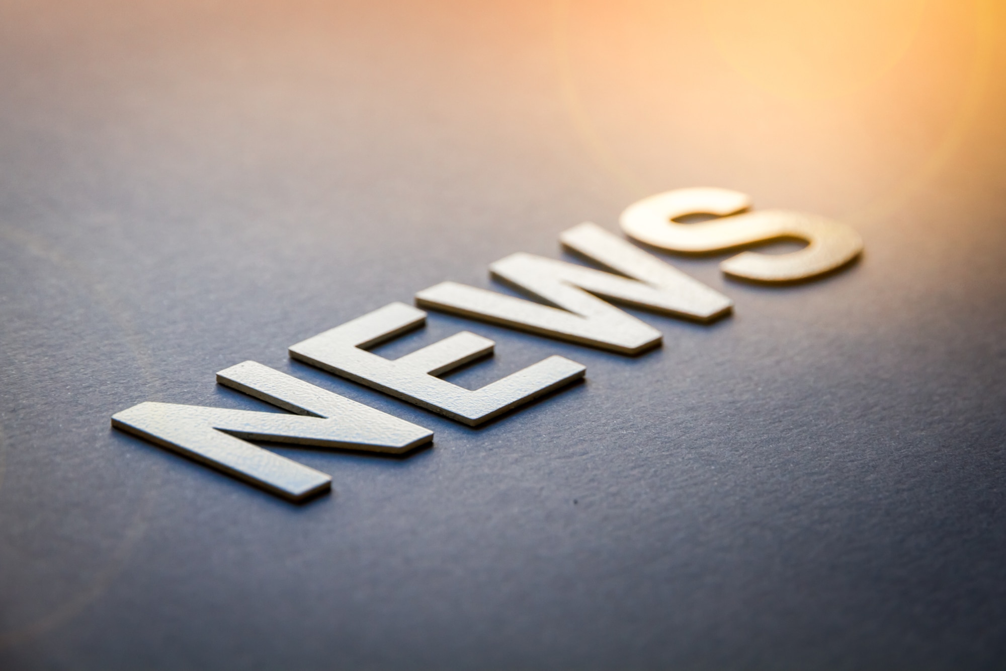 Word news written with white solid letters